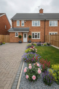 Showcase · Semi-detached house with bay standards at the door and a curving bed of pink roses and salvias