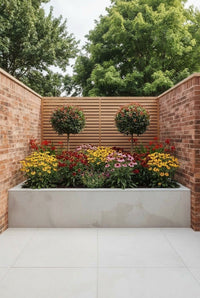 Showcase · Pair of Red Robin lollipops above rudbeckia, coneflowers and red crocosmia in a stone planter