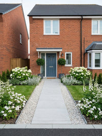 Showcase · Straight-on view of the house with laurel standards at the door and a white-flowered border each side